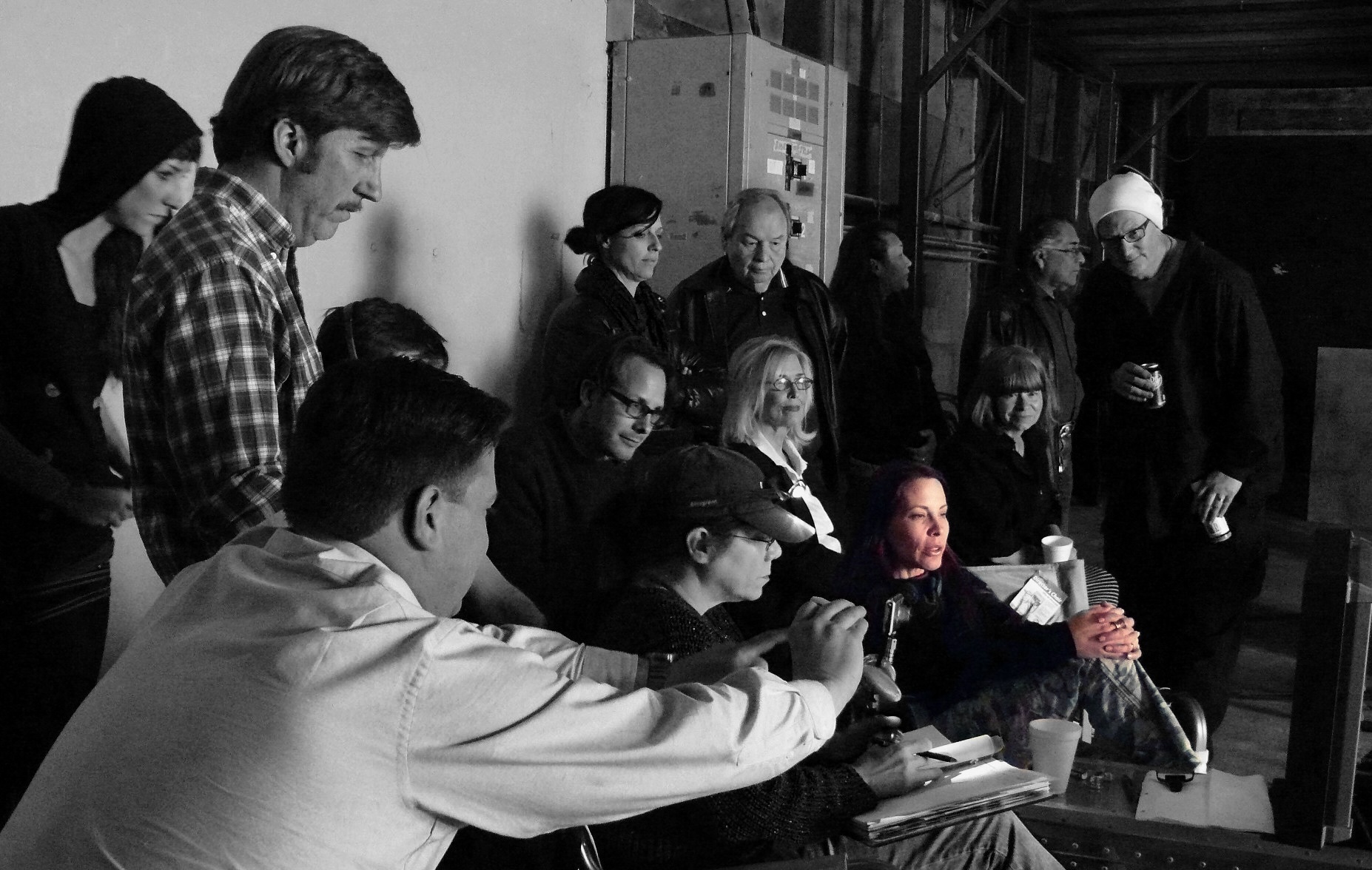 Annie Biggs with the cast and crew at the table during a read